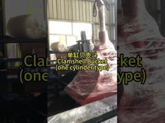 Xem máy xúc Teledipper với thùng vỏ sò có răng để demo xây dựng